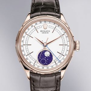 La montre traditionnelle selon Rolex La Rolex Cellini Moonphase en or Everose. Boîtier : 39 mm. Cadran : blanc. Bracelet cuir. #Rolex #Cellini
